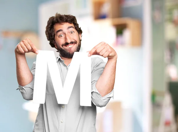 Crazy man with a letter M — Stock Photo, Image