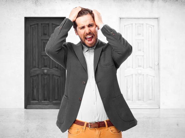 Scared businessman in frightened pose — Stock Photo, Image