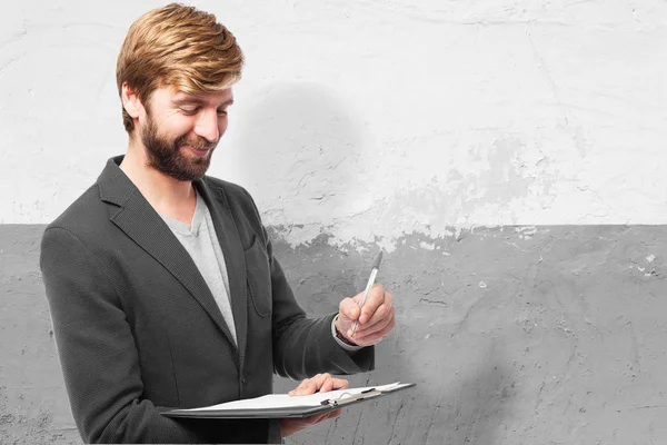 Hombre de negocios feliz con cuaderno — Foto de Stock