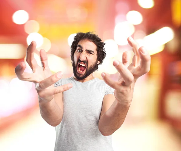 Wütender junger Mann in verrückter Pose — Stockfoto