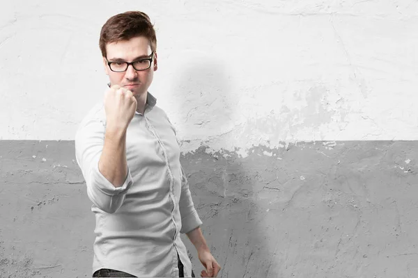Angry young man in celebrating pose — Stock Photo, Image