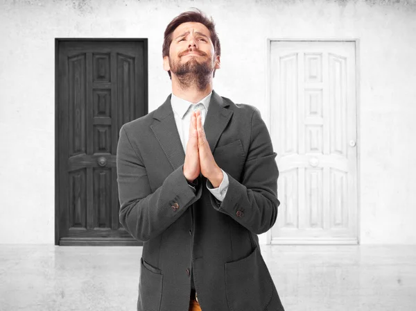 Sad businessman with praying gesture — Stock Photo, Image