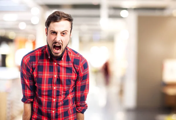 Angry young man shouting — Stock Photo, Image