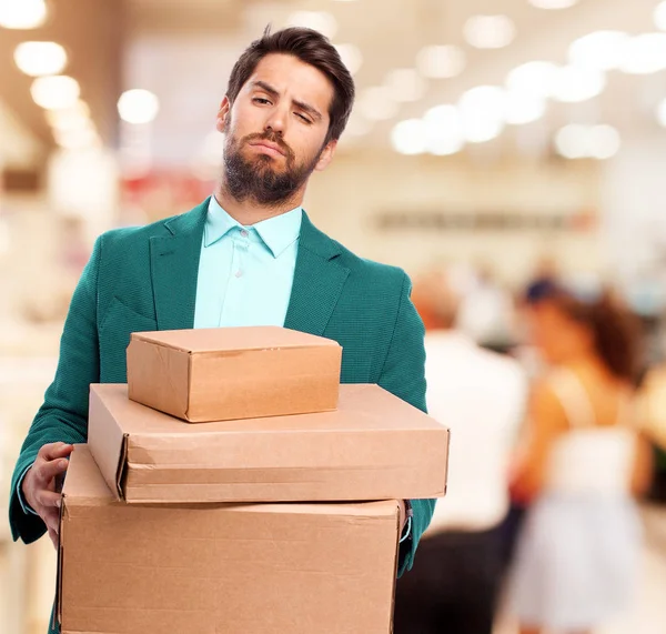 Aburrido hombre de negocios con cajas —  Fotos de Stock