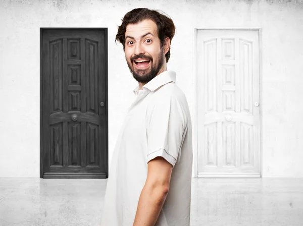 Young man near two doors — Stock Photo, Image