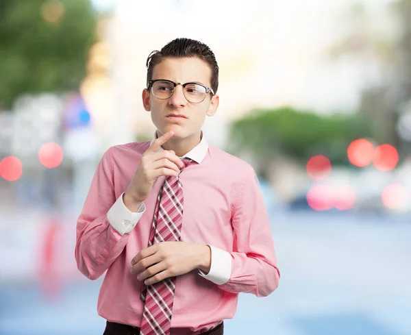 Angry young man in confused pose — Stock Photo, Image