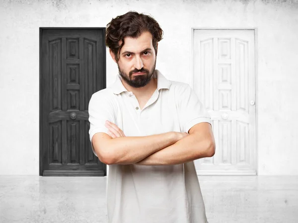 Angry young man cross arms — Stock Photo, Image