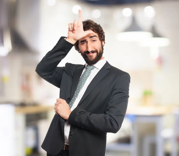 Proud businessman with loser sign — Stock Photo, Image