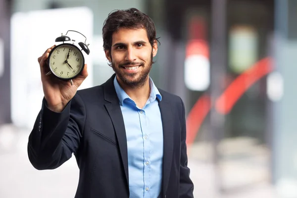 Homme d'affaires heureux avec horloge — Photo