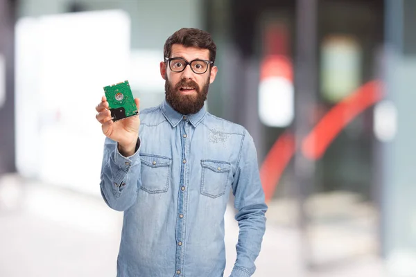 Jovem estressado com disco rígido — Fotografia de Stock