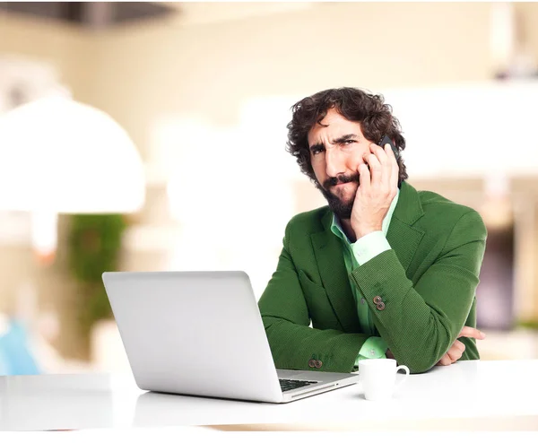 confused businessman with telephone