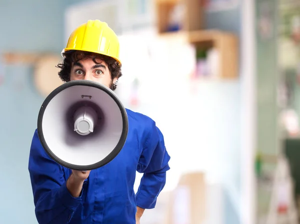 Angry worker man with megaphone — Stock Photo, Image