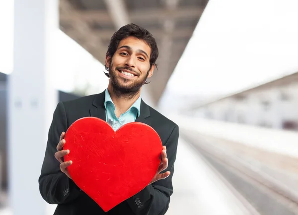 Happy businessman with heart symbol — Stock Photo, Image