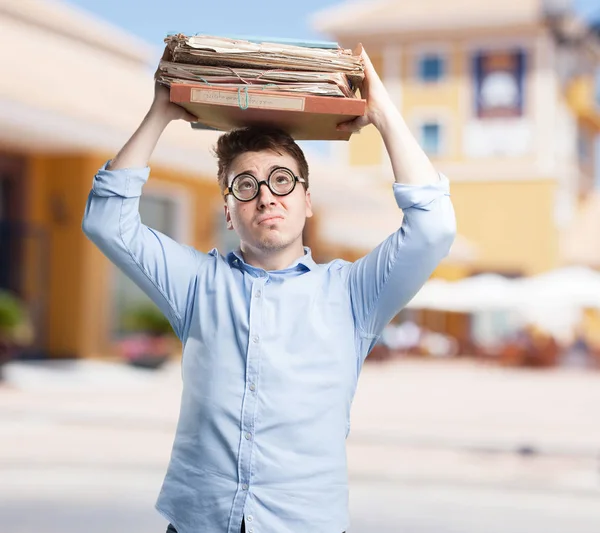 Crazy young man with files — Stock Photo, Image