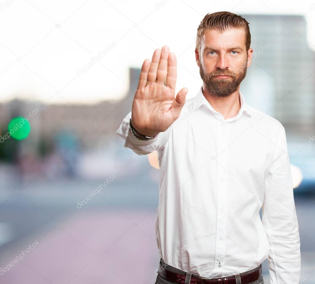 angry young man with stop gesture