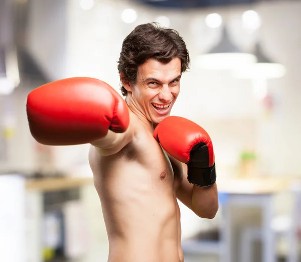 Strong young man boxing — Stock Photo, Image