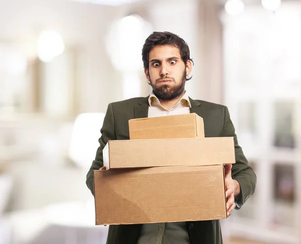 Happy businessman with boxes — Stock Photo, Image