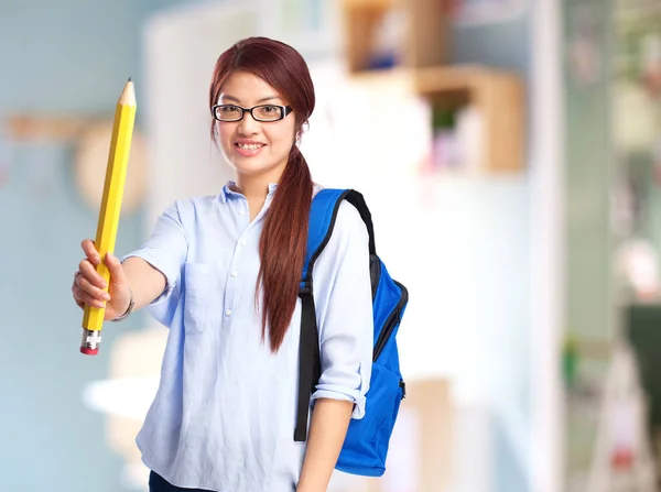 Happy chinese woman with pencil — Stock Photo, Image