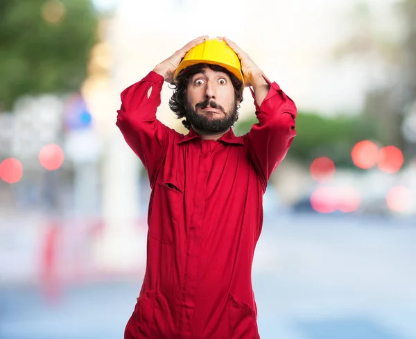 Scared worker man with crazy sign — Stock Photo, Image