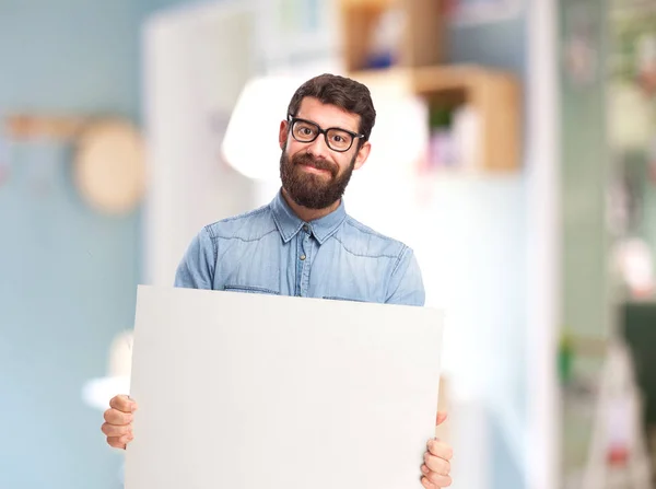 Happy young man with placard — Stock Photo, Image