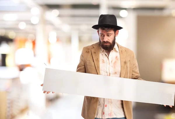 Triste sem-teto homem com cartaz — Fotografia de Stock