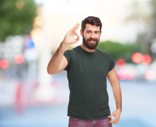 Happy young man with allright sign — Stock Photo, Image