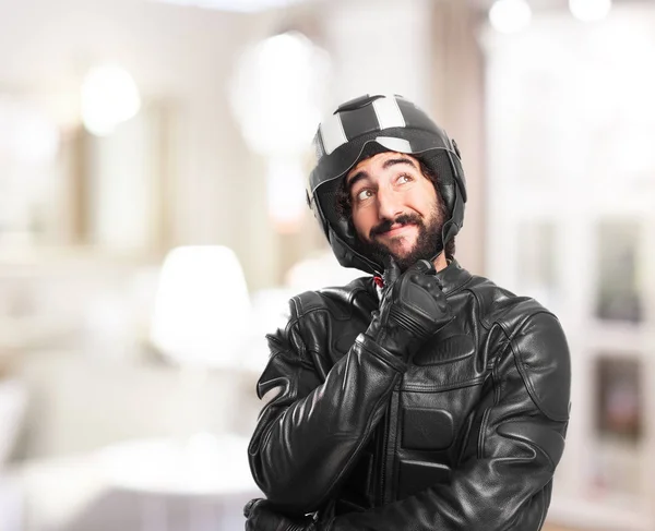 Happy biker thinking — Stock Photo, Image