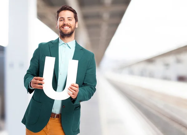 Hombre de negocios feliz con la letra U —  Fotos de Stock