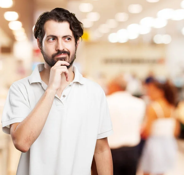 Gelukkig jonge man twijfelen — Stockfoto