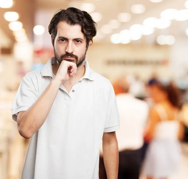 Joven feliz dudando — Foto de Stock