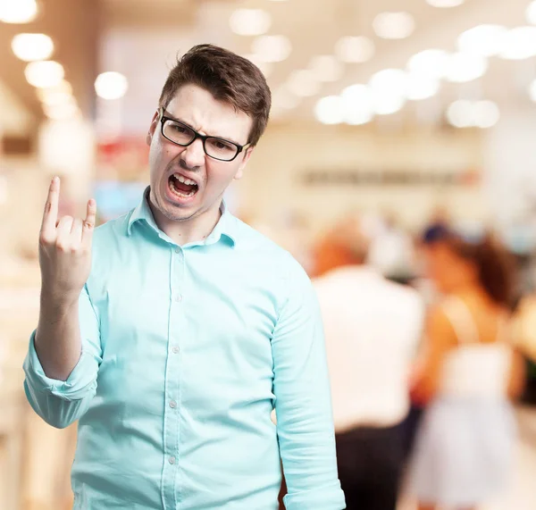 Angry young man with disagree sign — Stock Photo, Image
