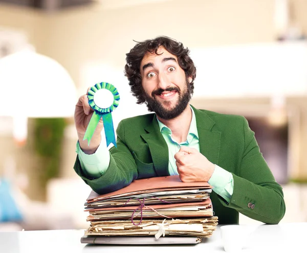 Businessman with files and medal — Stock Photo, Image