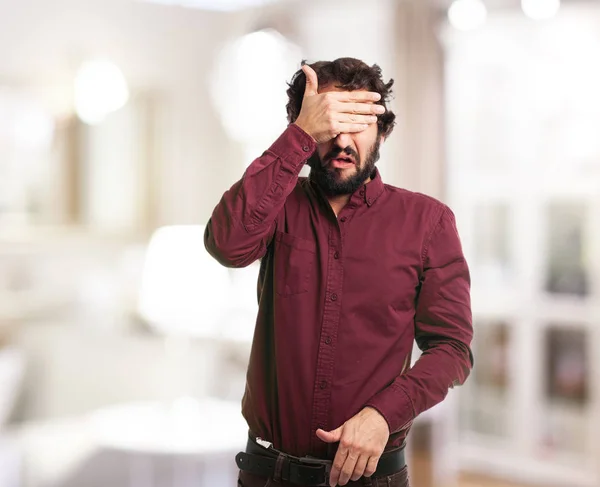 Worried young man covering eyes — Stock Photo, Image