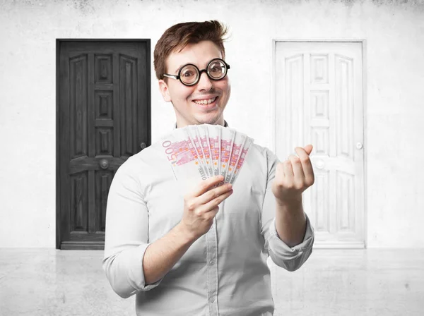 Happy young man with bills — Stock Photo, Image