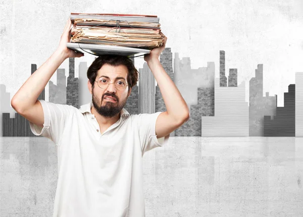 Jovem estressado com arquivos — Fotografia de Stock