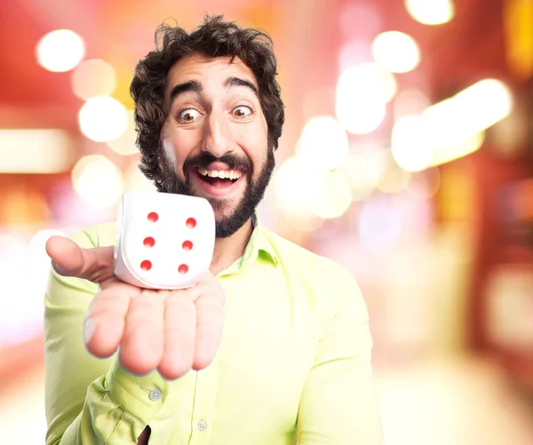 Happy young man with dice — Stock Photo, Image