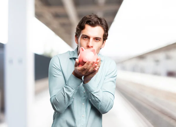 Hombre de negocios feliz con alcancía — Foto de Stock