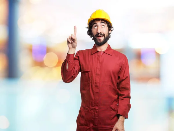 Happy worker man pointing up — Stock Photo, Image