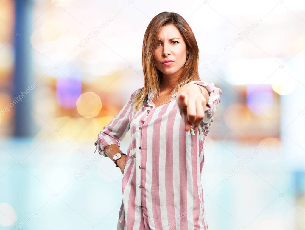 angry young woman pointing front