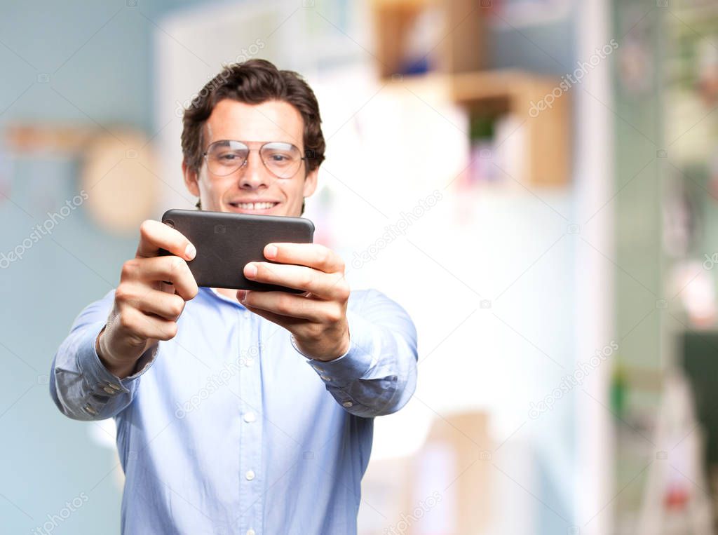 man doing selfie on mobile phone