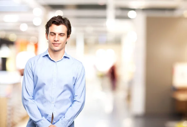 Boring young man smiling — Stock Photo, Image