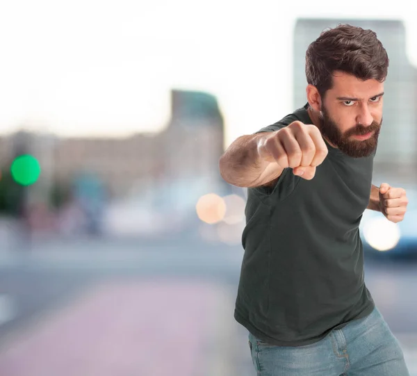 Angry young man with fist — Stock Photo, Image