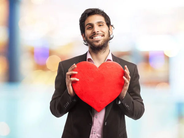 Homem de negócios indiano com um coração — Fotografia de Stock