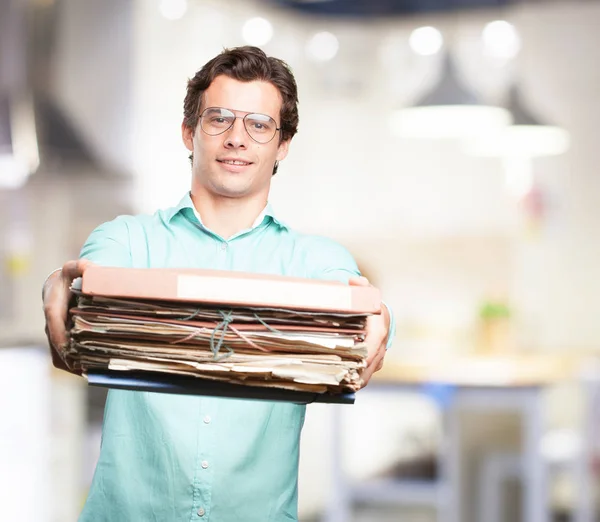 Happy young man with files — Stock Photo, Image