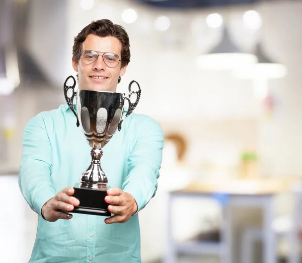 Happy young man with sport cup — Stock Photo, Image