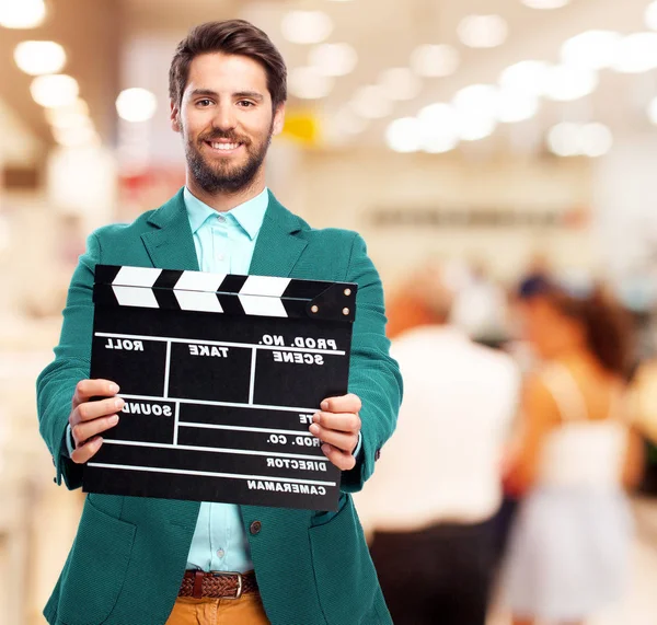 Happy businessman with clapper — Stock Photo, Image