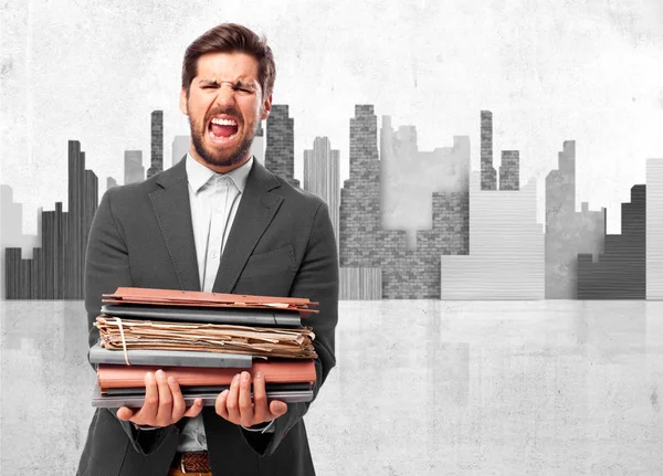 Angry businessman with files — Stock Photo, Image