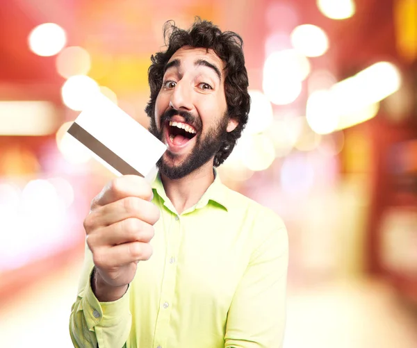 Kredi kartı ile mutlu genç adam — Stok fotoğraf
