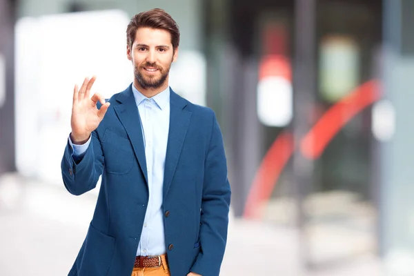 Happy businessman with allright sign — Stock Photo, Image