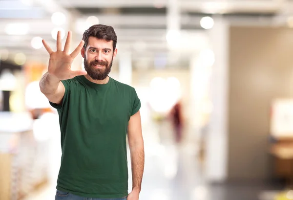 Hombre feliz con el signo número cinco —  Fotos de Stock